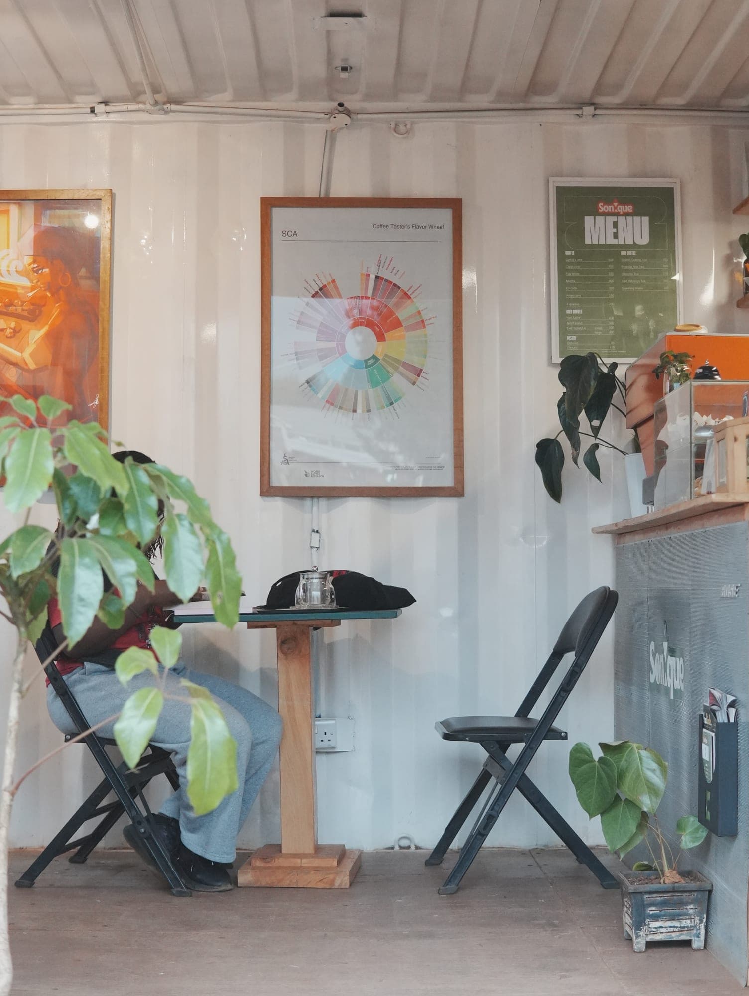 Paintings, plants and a quiet corner inside Sonique